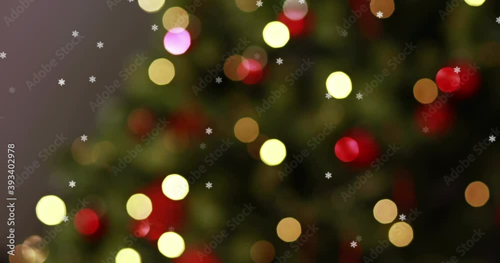 Animation of flickering fairy lights on christmas tree in the background Animation of flickering fairy lights on christmas tree in the background