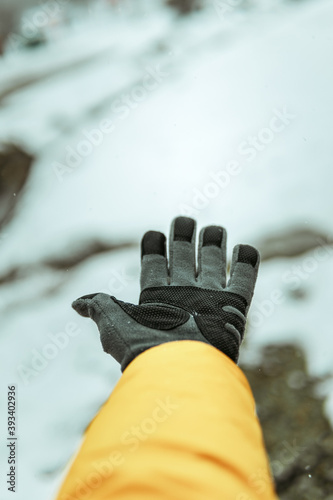 Cold day, raising my gloved hand in the snow