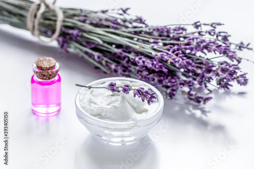 organic cosmetic with lavender flowers and oil on white background