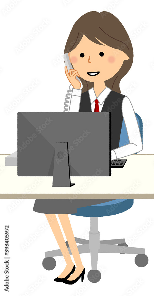 PCを見ながら電話する制服姿の女性 PCを見ながら電話する制服姿の女性