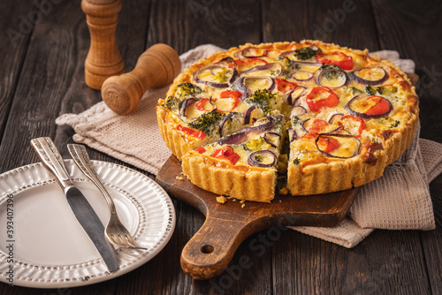Homemade quiche with vegetables and cheese, vegetarian food.