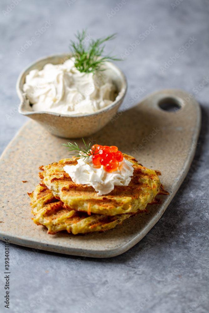 Hash Browns with Sour Cream, Dill and Red Caviar. Potato pancakes Hash Browns with Sour Cream, Dill and Red Caviar. Potato pancakes