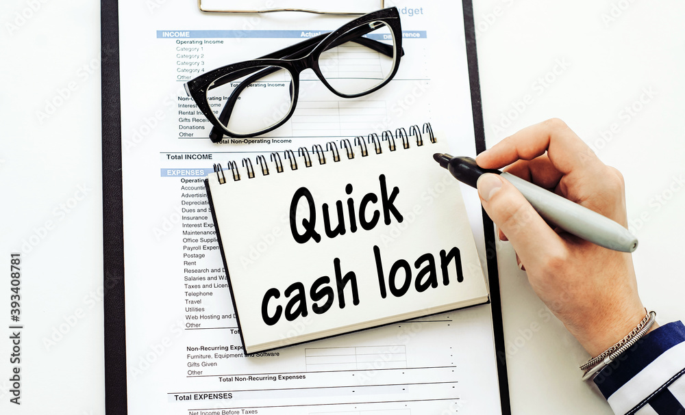Quick cash loan - text written by business woman in her diary on office desk. Quick cash loan - text written by business woman in her diary on office desk.