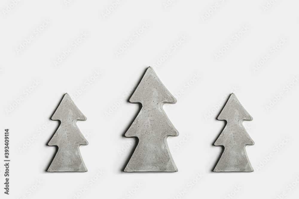 Fototapeta premium Hand made concrete christmas trees on white background