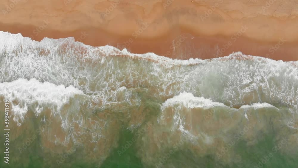 Aerial drone shot view the ocean of the ocean waves, beautiful waves do not end frames one by one while the turquoise sea waves break on the sandy coast. 4K Aerial drone shot view the ocean of the ocean waves, beautiful waves do not end frames one by one while the turquoise sea waves break on the sandy coast. 4K