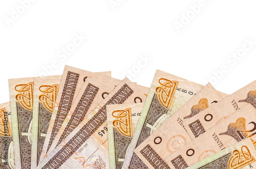 20 Dominican peso bills lies on bottom side of screen isolated on white background with copy space. Background banner template photo