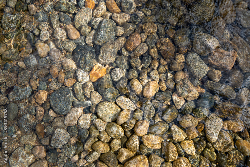 river stones under water