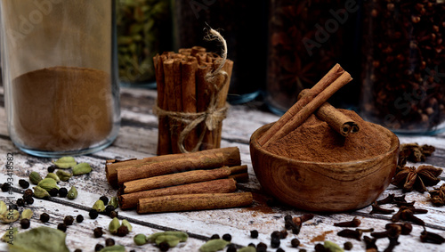 Bunch of cinnamon sticks on a white wooden table