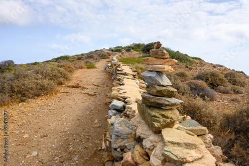 A composition of stones arranged on the path leading to the Tomb of Homer on Ios Island. Cyclades, Greece photo