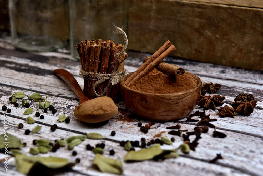 Bunch of cinnamon sticks on a white wooden table Bunch of cinnamon sticks on a white wooden table