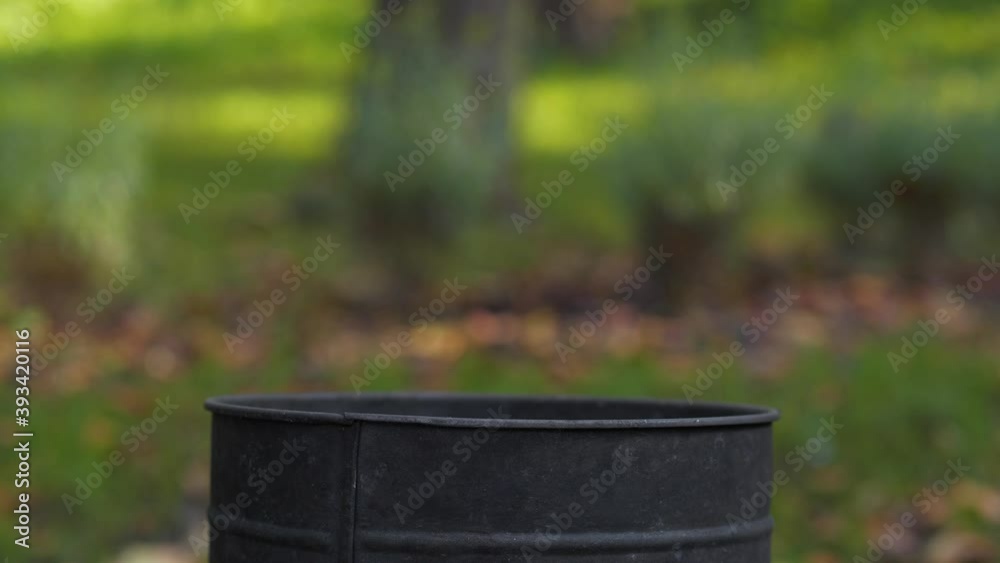 Used medical protective mask is thrown into the trash can on the street. 4K Slow Motion video Used medical protective mask is thrown into the trash can on the street. 4K Slow Motion video