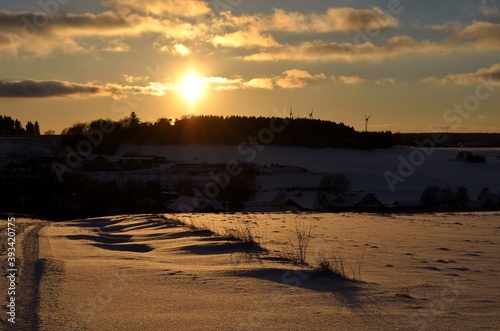 Sunset over snow covered landscape