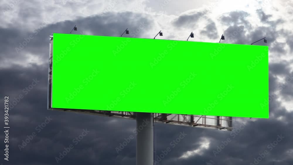 Empty large billboard with a green screen for advertising against sky with clouds timelapse Empty large billboard with a green screen for advertising against sky with clouds timelapse