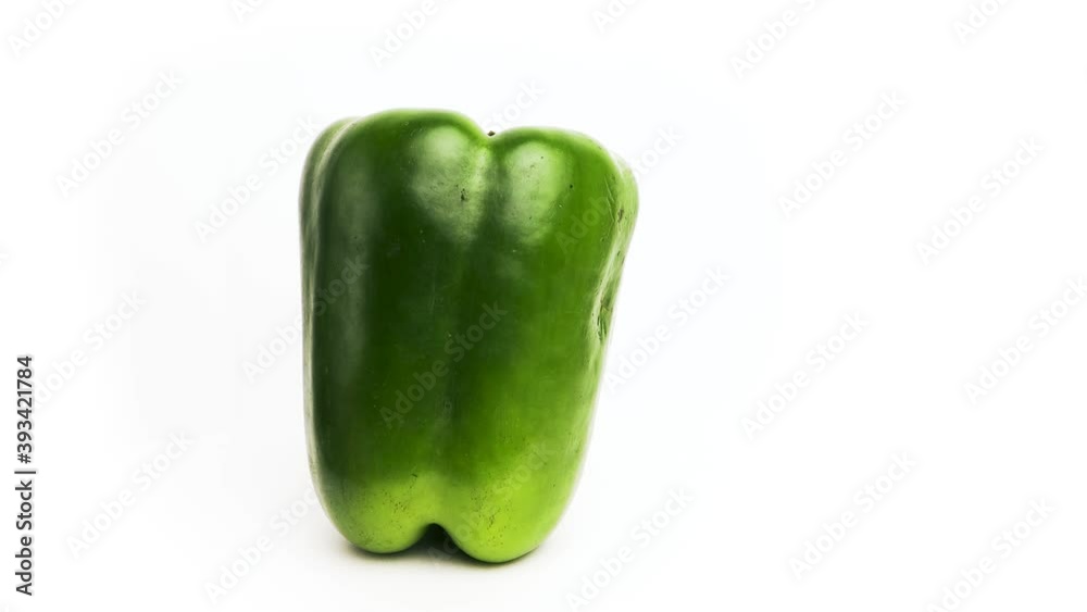 Fresh green pepper vertically spins in 360 degrees