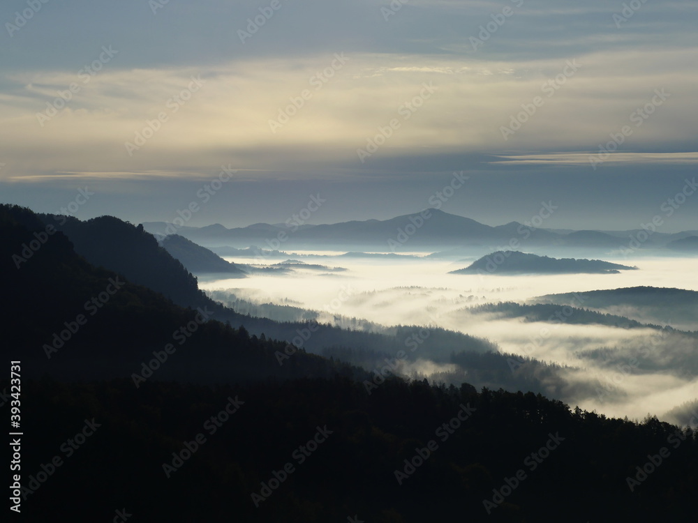 Misty silent hilly landcape. Fairy sunrise in hilly forest landscape in the morning wake up view Misty silent hilly landcape. Fairy sunrise in hilly forest landscape in the morning wake up view