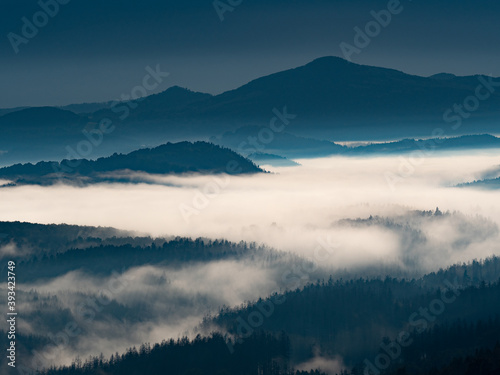 Fairy sunrise in hilly forest landscape in the morning. Wake up view in mountains