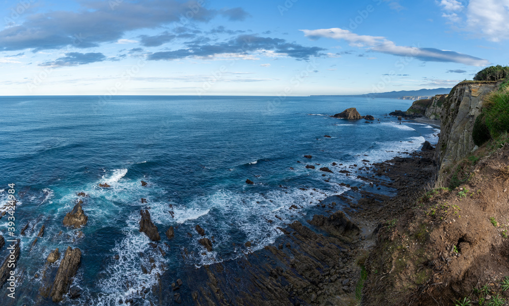 rugged and wild coastline in northern Spain with cliffs and rocky beach