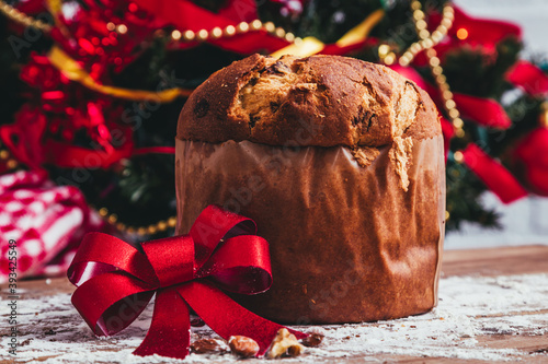 christmas panettone with red bow and ornaments