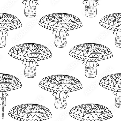 Cute fantasy doodle mushroom with ornamental cap seamless pattern. Woodland background. Vector illustration.