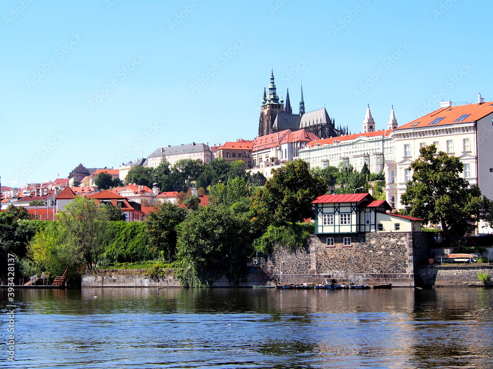 view of Prague from the deck of a steamer, historical city center, panorama on the Vltava, sunny summer day, tourism