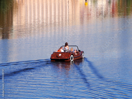 view of a pedal boat, historical city center, panorama on the Vltava river, sunny summer day, tourism in the capital, relaxation