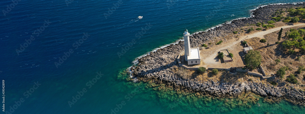 Aerial drone ultra wide photo of picturesque lighthouse in small rocky islet of Kranai in village of Gytheio, Lakonia, Peloponnese, Greece