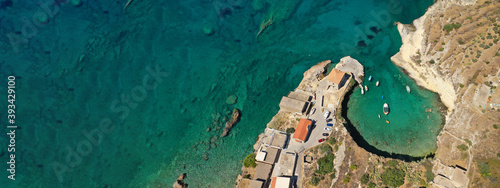 Aerial drone ultra wide photo of beautiful scenic seaside village and bay of Mezapos with crystal clear emerald sea, Lakonia, Mani peninsula, Greece photo