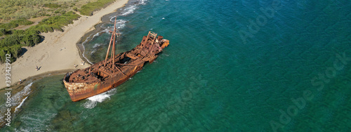 Aerial drone ultra wide photo of famous abandoned old rusty shipwreck of Dimitrios in Selinitsa bay Githeio, Peloponnese, Laconia, Greece photo