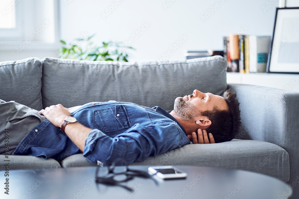 Relaxed man sleeping on sofa Relaxed man sleeping on sofa