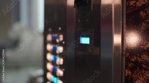Street vending coffee machine at night closeup. High quality 4k footage photo