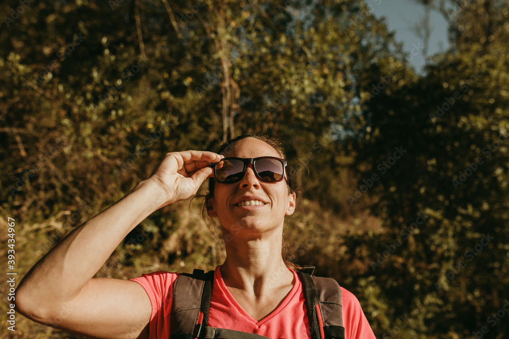 Woman wearing sunglasses while standing at Sierra De Hornachuelos, Cordoba, Spain Woman wearing sunglasses while standing at Sierra De Hornachuelos, Cordoba, Spain