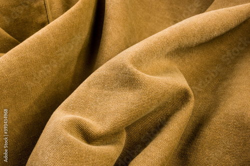 clothing items stonewashed cotton fabric texture with seams, clasps, buttons and rivets, macro