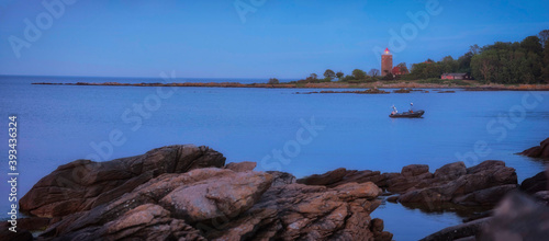 Denmark, Bornholm, Hammershus, Fortress ruins and sea at dusk photo