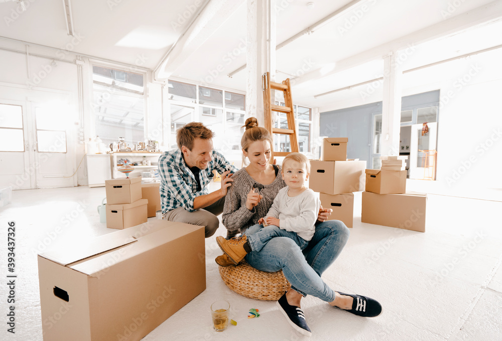 Happy family moving into new home Happy family moving into new home