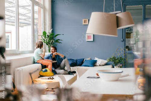 Father and son having a snack at home