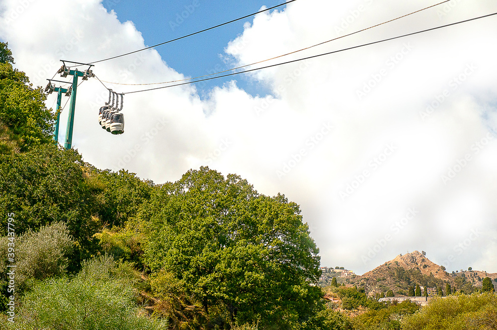 Taormina Mare is the coastal resort of Taormina high on its hilltop. It is a popular tourist resort with a sweeping bay. There is a frequent cable car service that takes people up and down to the sea