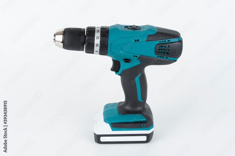 Green cordless hammer screwdriver drill on white background. The drill can be used as a drill hammer or a screwdriver or flat drill The drill has two speed an keyless chuck. Green cordless hammer screwdriver drill on white background. The drill can be used as a drill hammer or a screwdriver or flat drill The drill has two speed an keyless chuck.