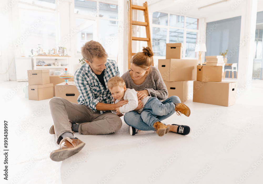 Happy family moving into new home Happy family moving into new home