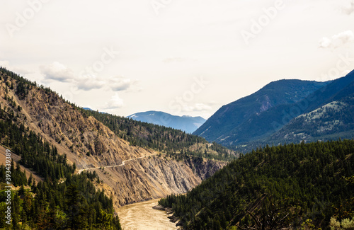 Mountains and road along Fraser River  BC  Canada.