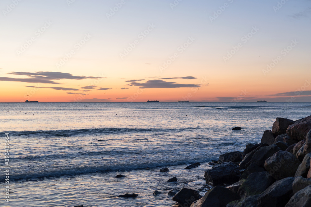 Sea rocks and blue sea and sunrise in Odessa on the beach