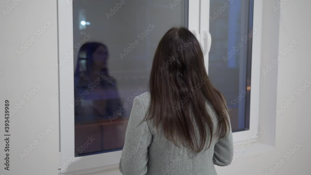 Woman buyer inspecting new apartment, white interior, view of the rooms, moving into new apartment, home construction. Woman buyer inspecting new apartment, white interior, view of the rooms, moving into new apartment, home construction.