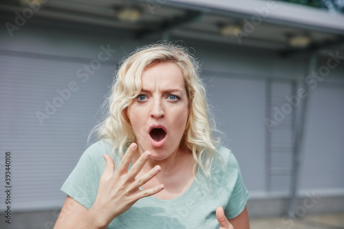 Portrait of shocked woman outdoors photo