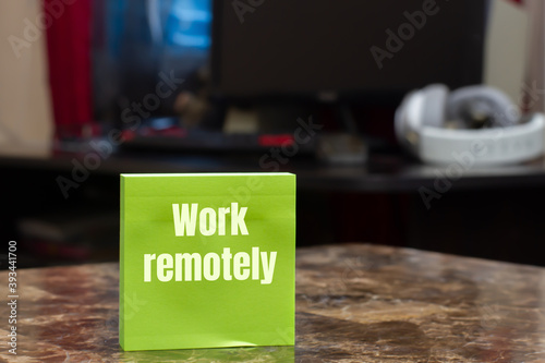 Work remotely sign on the wooden desk about remote job