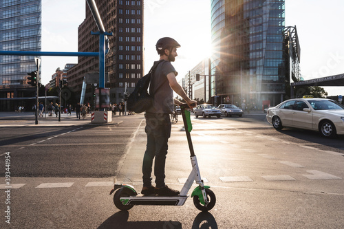 Man using e-scooter in Berlin, Germany photo