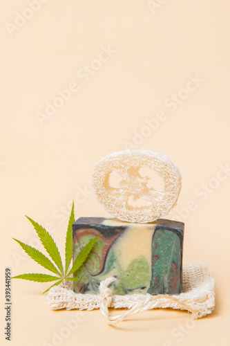 Homemade hemp soap and green leaf of marijuana. Spa organic soap. Organic skincare product with medicinal CBD. Zero waste concept