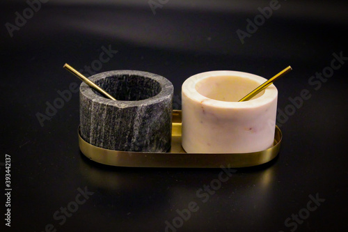 Salt shaker and spice bowl isolated black
