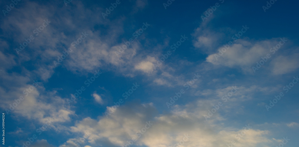 Grey white clouds in a blue sky in bright sunlight in autumn, Almere, Flevoland, The Netherlands, November 18, 2020
