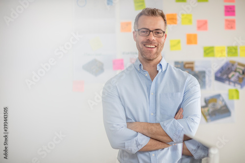Portrait of smiling businessman in office