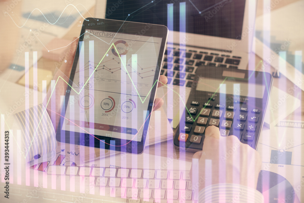 Double exposure of man's hands holding and using a digital device and forex graph drawing. Financial market concept. Double exposure of man's hands holding and using a digital device and forex graph drawing. Financial market concept.