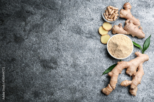 Dry, fresh and capsuled ginger on grey table, flat lay. Space for text